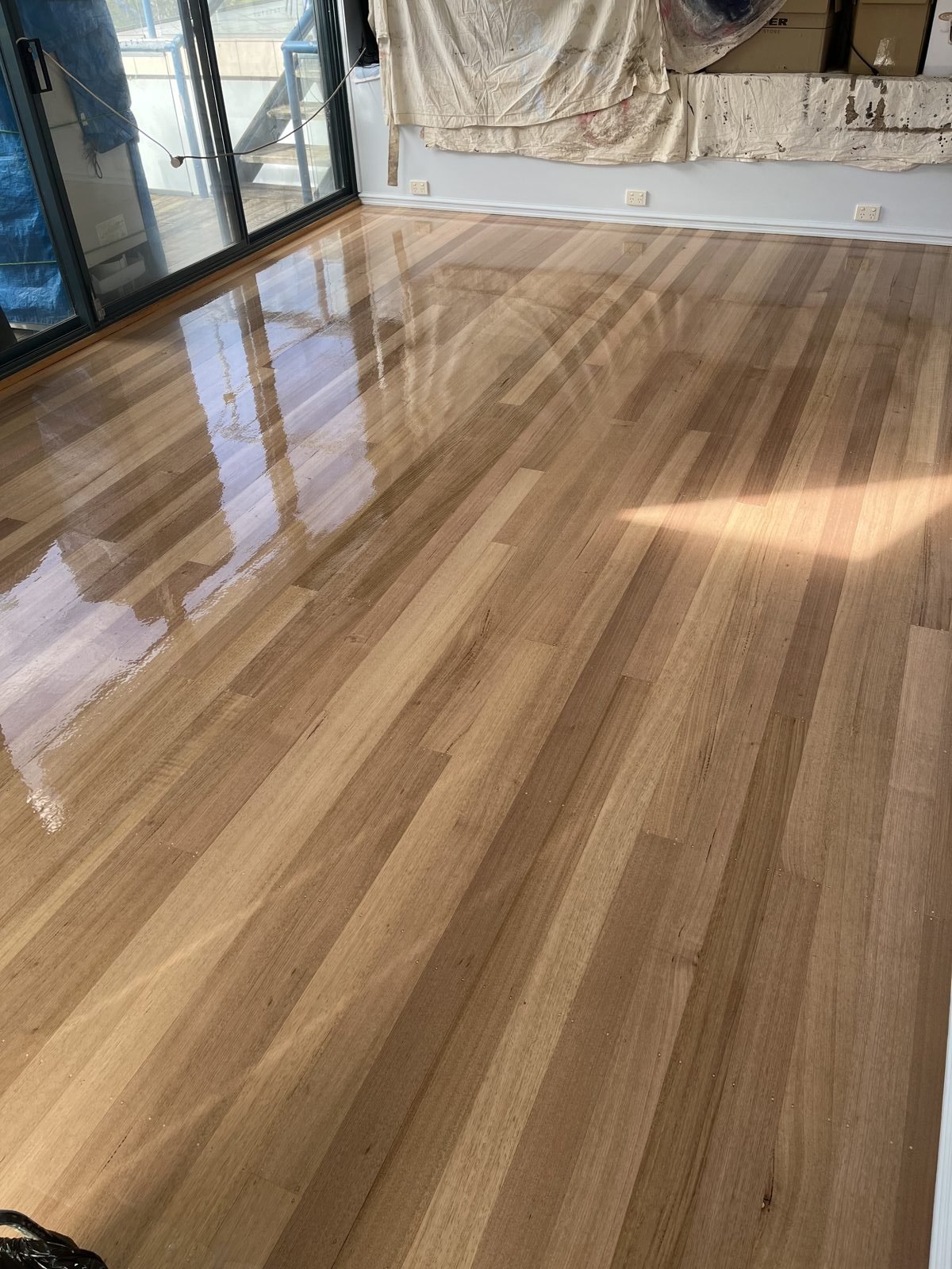 Freshly coated glossy timber floor
